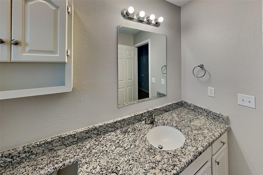 604 Ashby Place Allen, TX 75002 - Photo 17 of 21 a bathroom with a granite countertop sink and a mirror