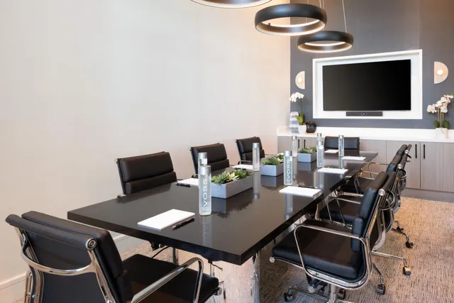 a kitchen with lots of counter top space and wooden floor