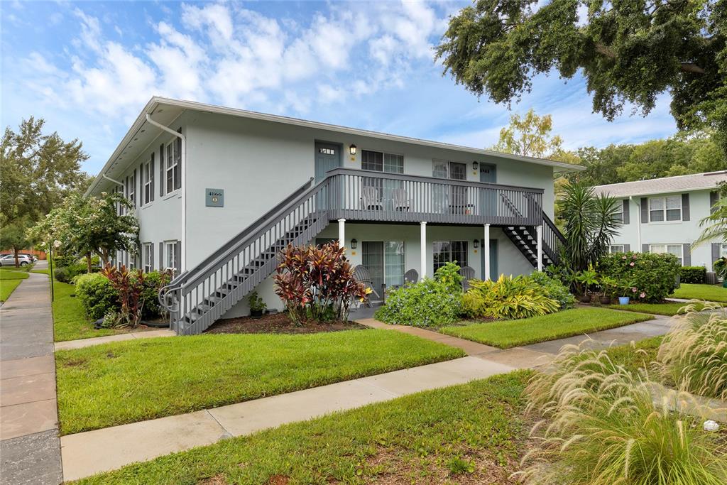 4866 South Conway Road, Unit 116 Orlando, FL 32812 - Photo 1 of 1 a front view of a house with a yard
