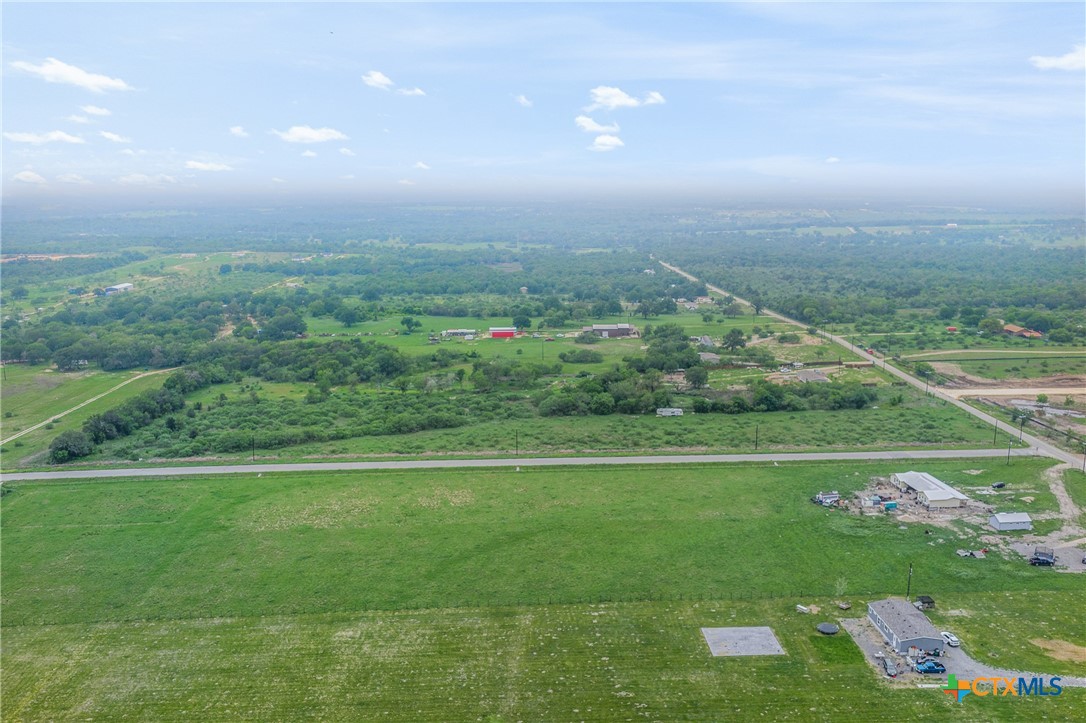 6497 Taylorsville Road Dale, TX 78616 - Photo 14 of 36 a view of a green field with an ocean view