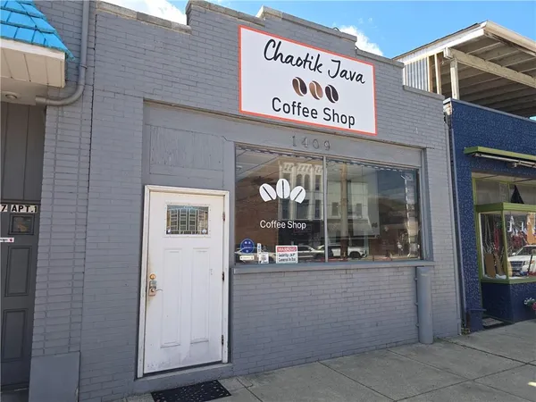 a view of a store with parking