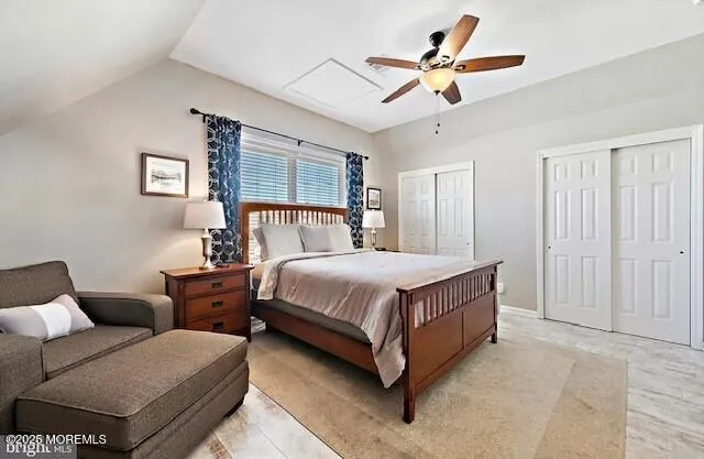 a bed room with a bed and a ceiling fan