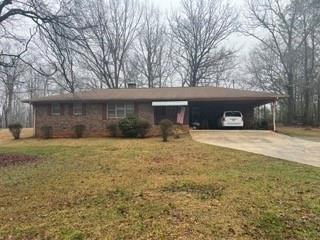 a view of a house with a yard and garage