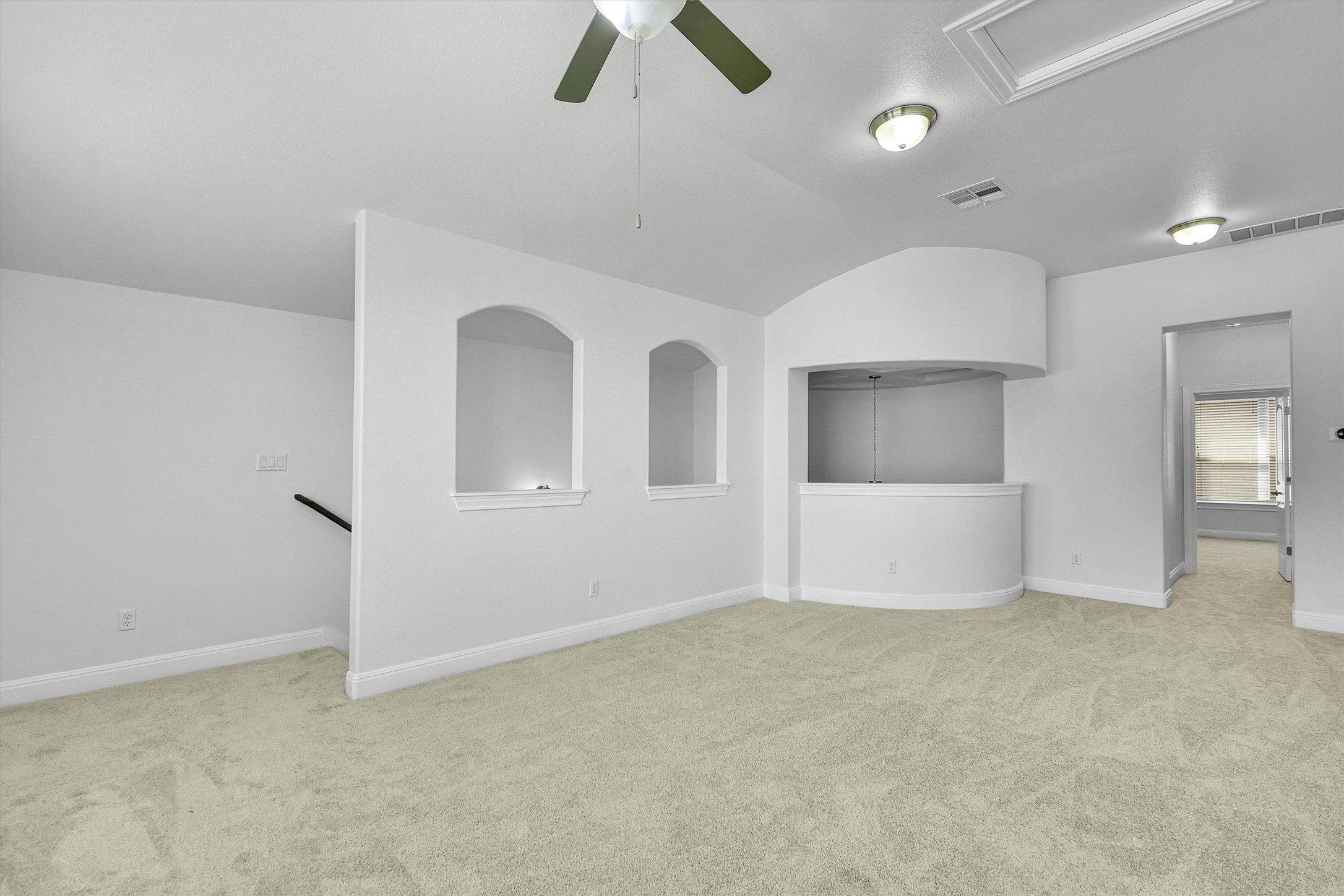 2325 Blended Tree Ranch Drive Leander, TX 78641 - Photo 29 of 35 A spacious common area offers ample room for gathering and features elegant arched wall niches.