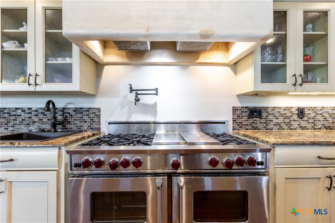 1440 West Klein Road New Braunfels, TX 78130 - Photo 14 of 42 a kitchen with a stove and a sink