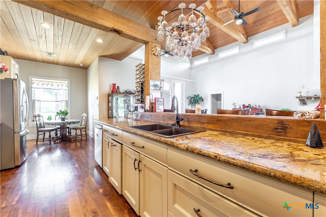 1440 West Klein Road New Braunfels, TX 78130 - Photo 15 of 42 a view of a kitchen with kitchen island granite countertop lots of counter top space and furniture