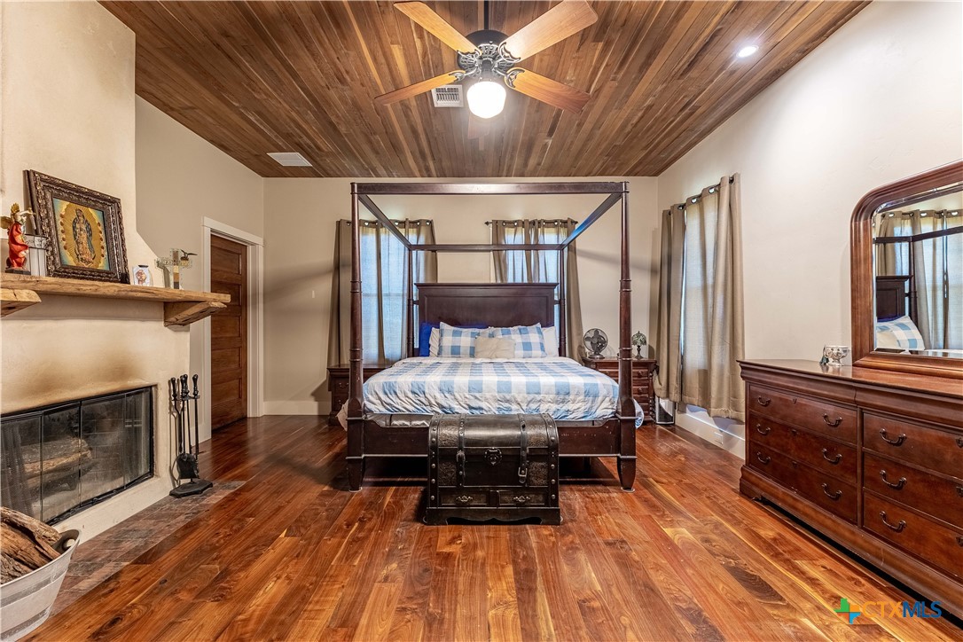 1440 West Klein Road New Braunfels, TX 78130 - Photo 17 of 42 a living room with furniture a fireplace and a chandelier