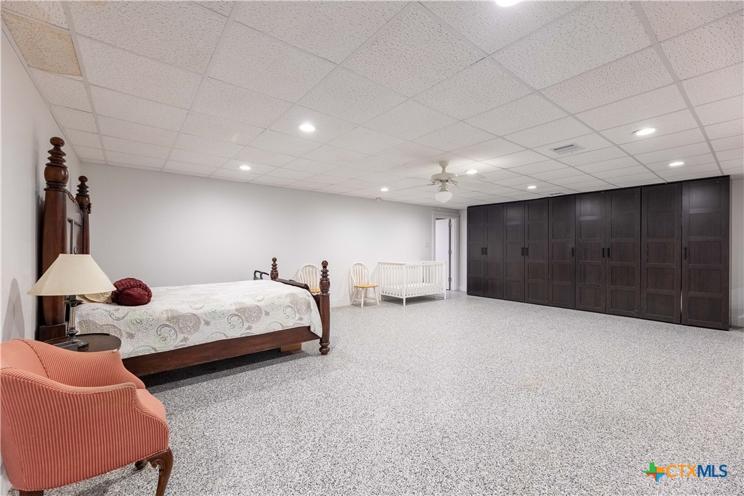 1440 West Klein Road New Braunfels, TX 78130 - Photo 28 of 42 a spacious bedroom with a bed and a couch