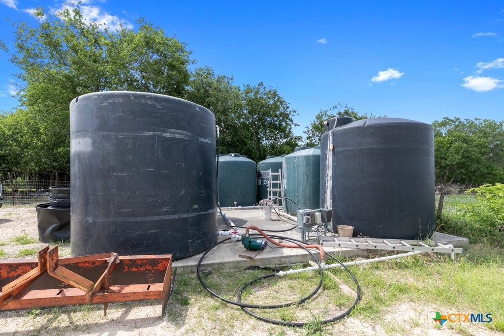 1440 West Klein Road New Braunfels, TX 78130 - Photo 40 of 42 a backyard of a house with yard barbeque oven and outdoor seating