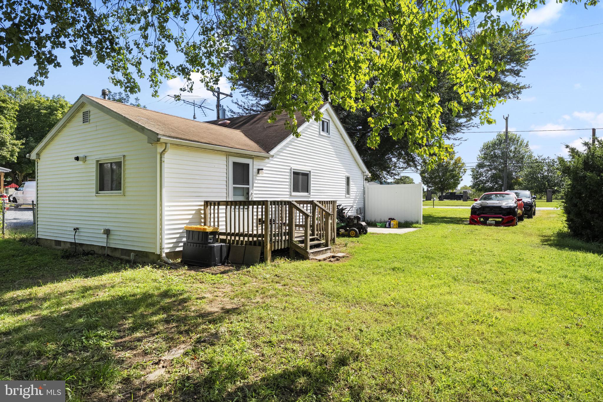 5087 Wheatleys Pond Road Smyrna, DE 19977 - Photo 21 of 36 a view of a house with a yard and sitting area