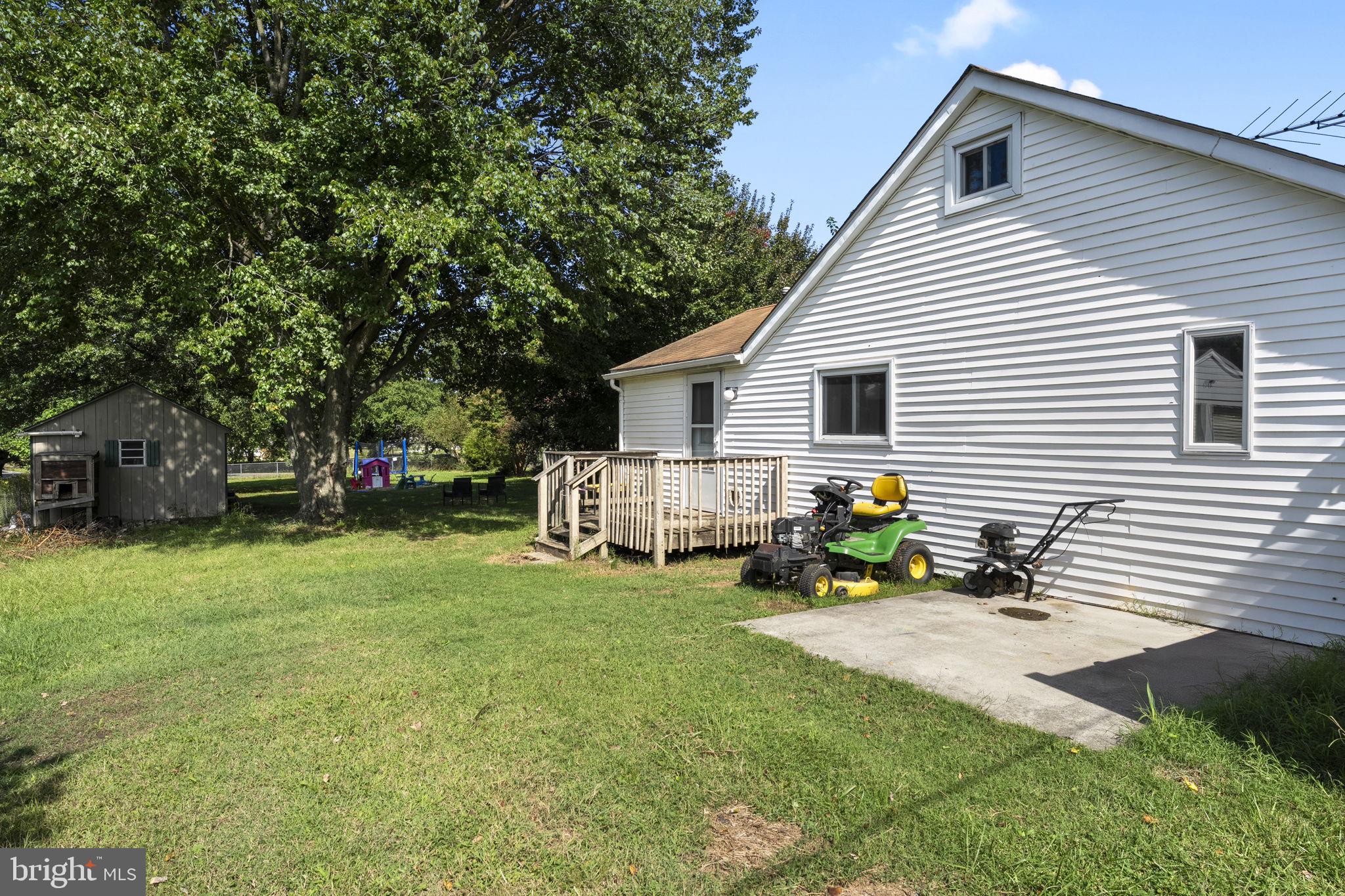 5087 Wheatleys Pond Road Smyrna, DE 19977 - Photo 22 of 36 a view of a house with a yard and sitting area