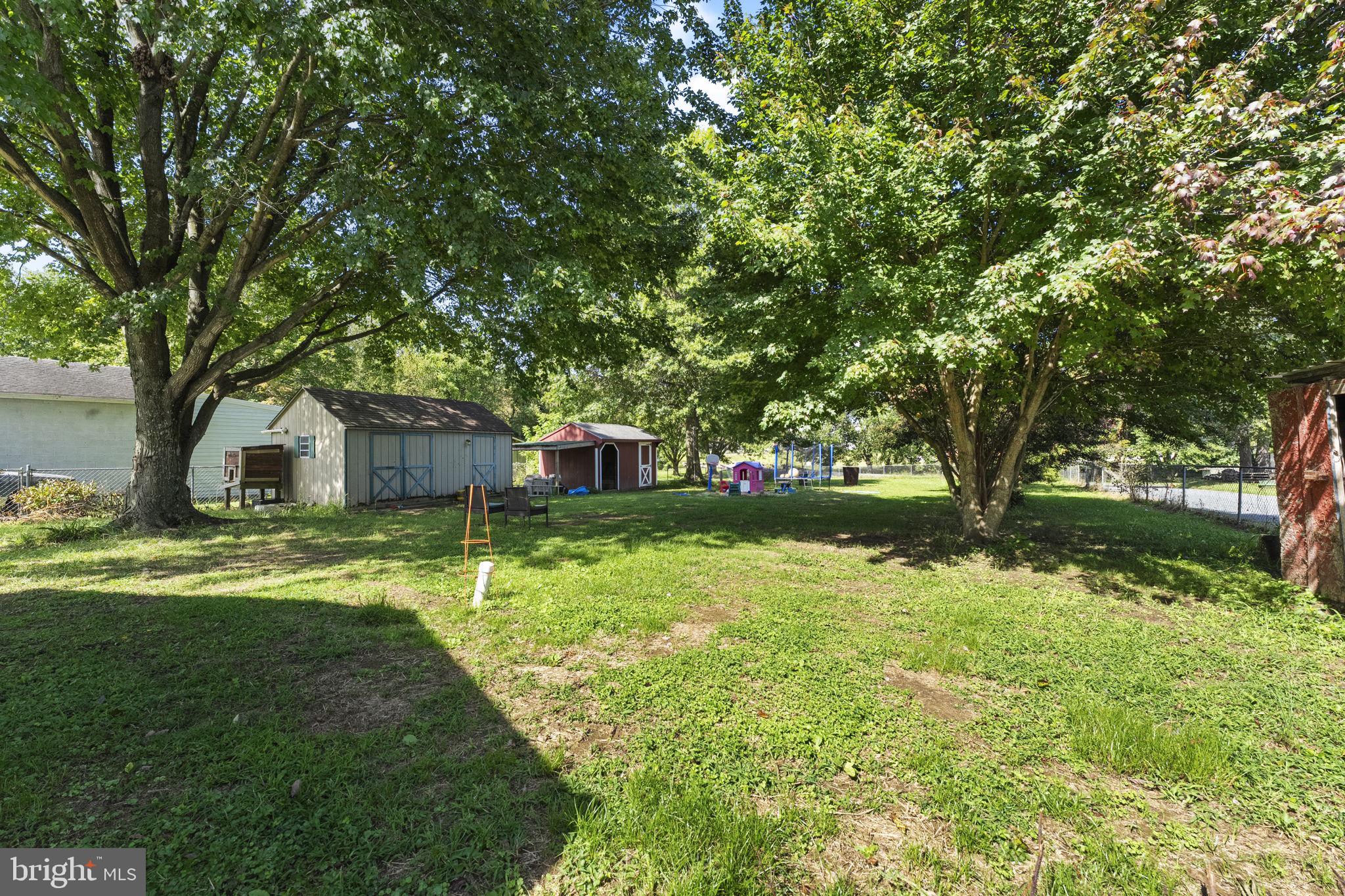 5087 Wheatleys Pond Road Smyrna, DE 19977 - Photo 25 of 36 a front view of a house with garden