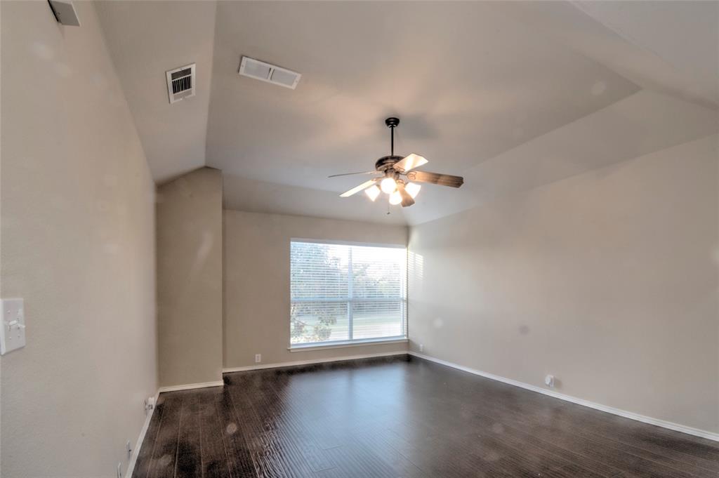 2012 Trinity Lane McKinney, TX 75072 - Photo 18 of 32 a view of room with a ceiling fan and window