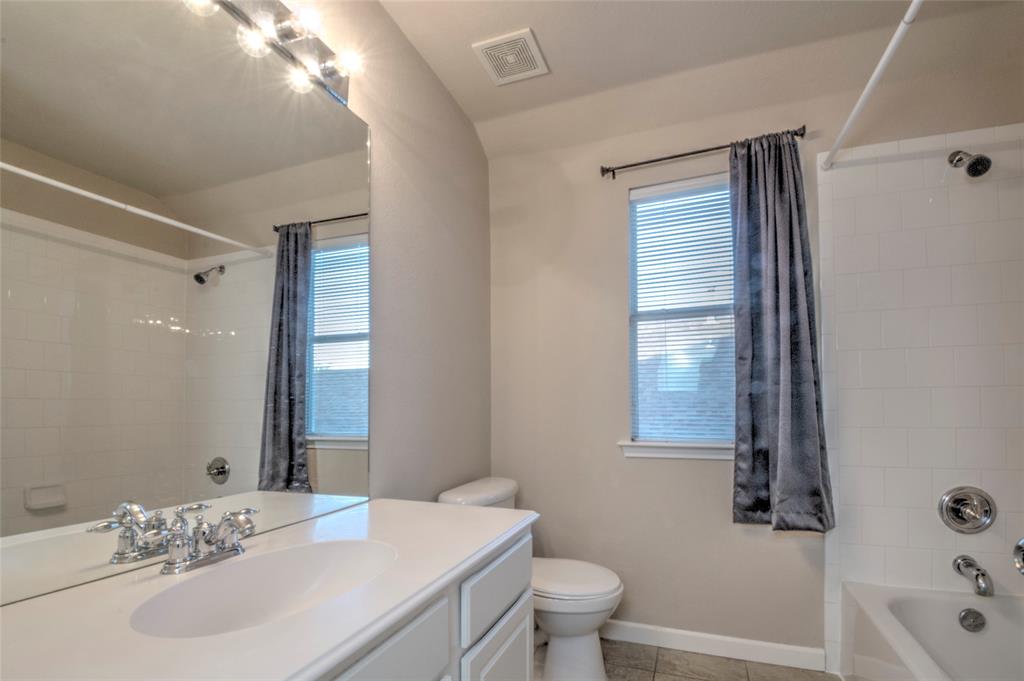 2012 Trinity Lane McKinney, TX 75072 - Photo 19 of 32 a bathroom with a sink a toilet and shower