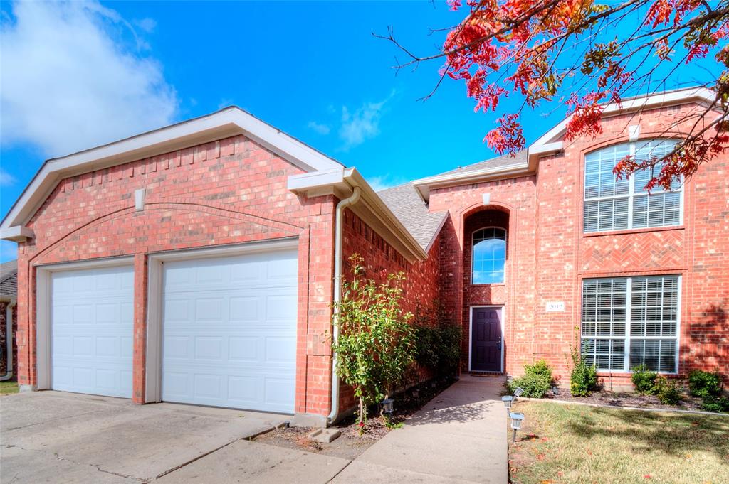 2012 Trinity Lane McKinney, TX 75072 - Photo 2 of 32 a front view of a house with a yard