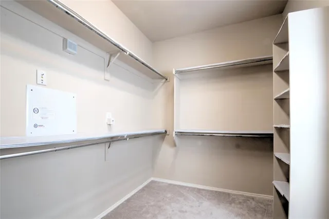 a close view of an empty walk in closet