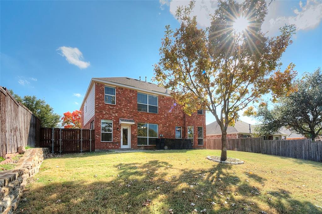 2012 Trinity Lane McKinney, TX 75072 - Photo 25 of 32 a view of a yard with a house in the background