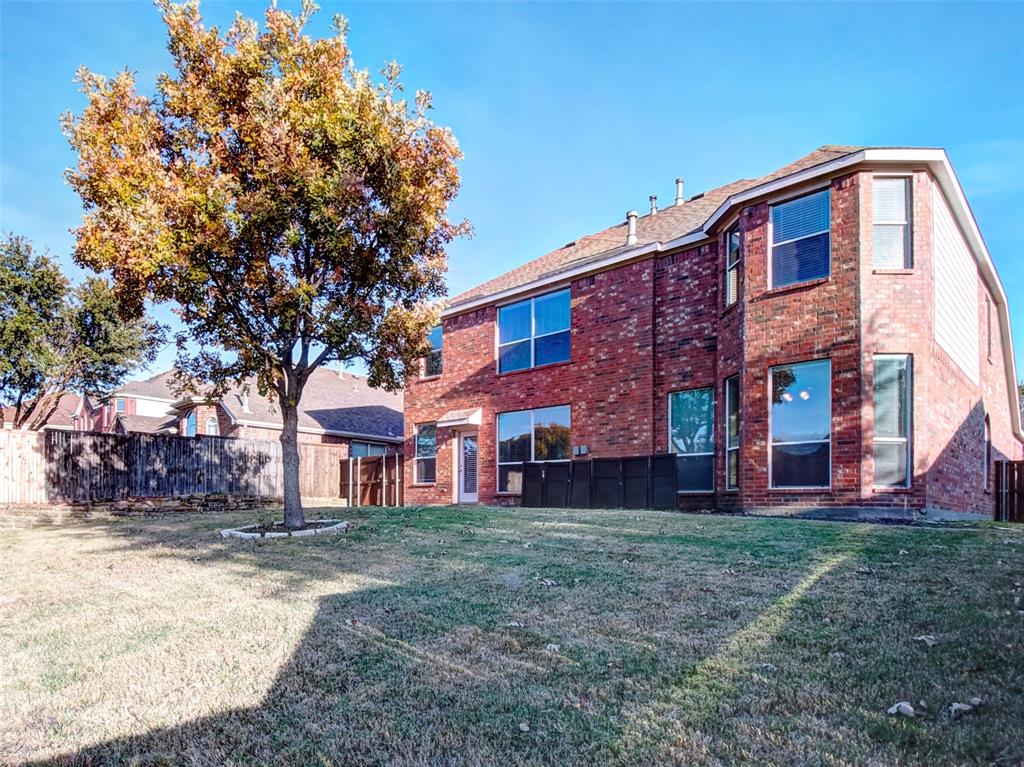 2012 Trinity Lane McKinney, TX 75072 - Photo 27 of 32 a front view of a house with a yard