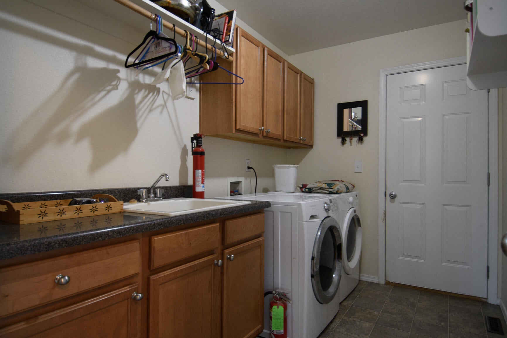 16886 Jacinto Road Bend, OR 97707 - Photo 20 of 26 Laundry & door to 2-car garage