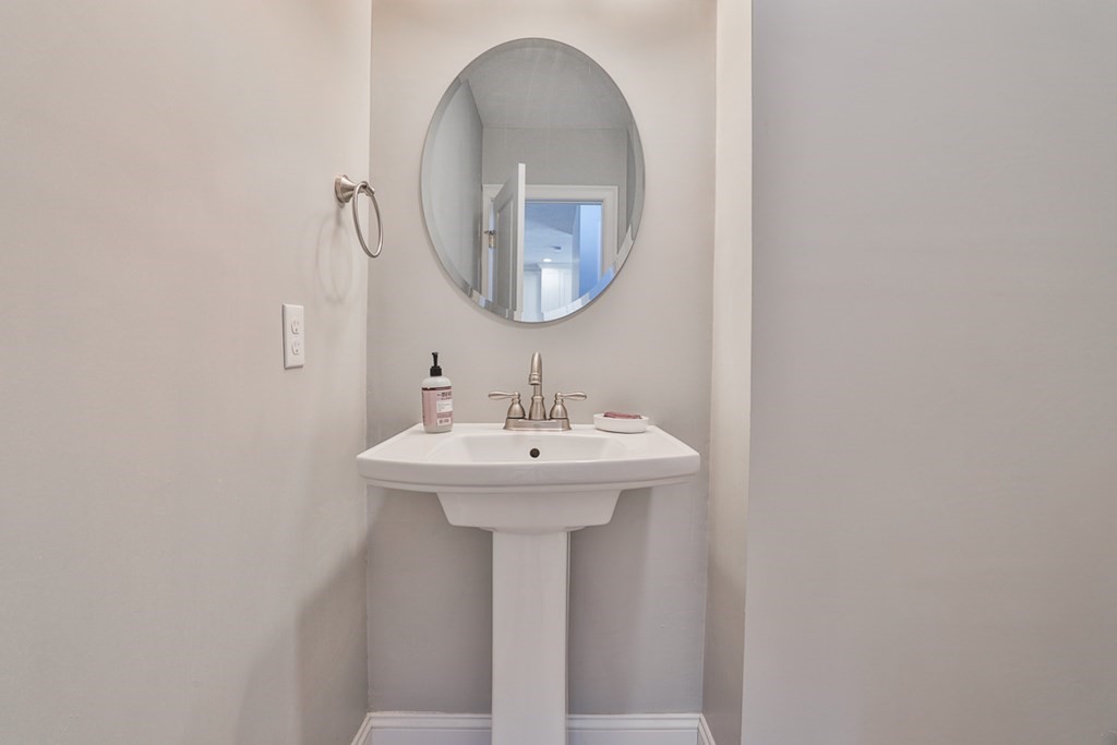 2 Trail Ridge Way, Unit D Harvard, MA 01451 - Photo 17 of 31 a bathroom with a sink a mirror and vanity