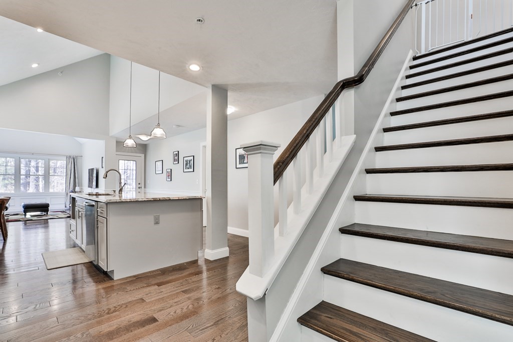 2 Trail Ridge Way, Unit D Harvard, MA 01451 - Photo 21 of 31 a living room with wooden floor and stairs