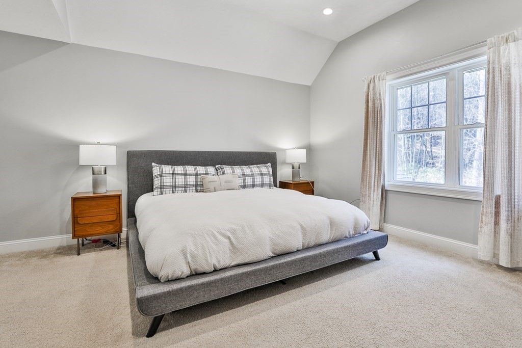 2 Trail Ridge Way, Unit D Harvard, MA 01451 - Photo 29 of 31 a bed sitting in a bedroom next to a window