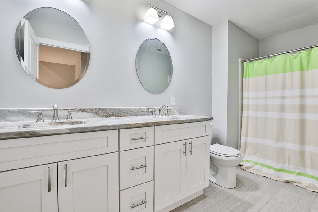 2 Trail Ridge Way, Unit D Harvard, MA 01451 - Photo 30 of 31 a bathroom with 2 sink and a mirror