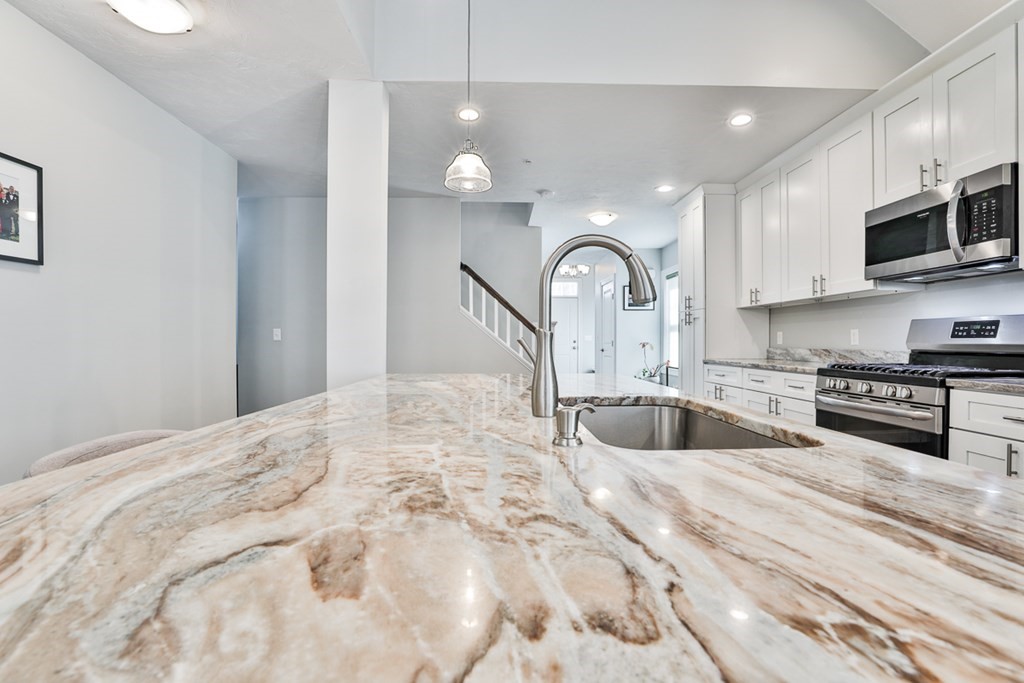 2 Trail Ridge Way, Unit D Harvard, MA 01451 - Photo 7 of 31 a large white kitchen with stainless steel appliances