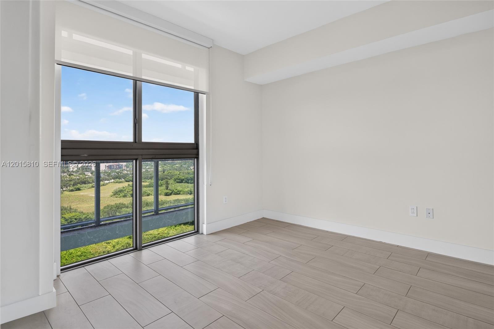 2000 Metropica Way, Unit 1902 Sunrise, FL 33323 - Photo 18 of 40 a view of an empty room with window
