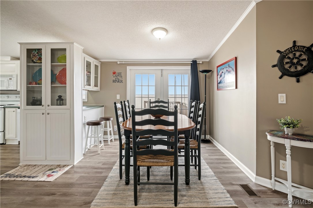 374 James River Overview Spring Grove, VA 23881 - Photo 16 of 49 a view of a dining room with furniture and wooden floor