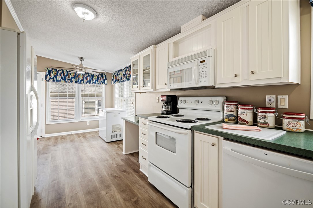374 James River Overview Spring Grove, VA 23881 - Photo 22 of 49 a kitchen with a stove and white cabinets