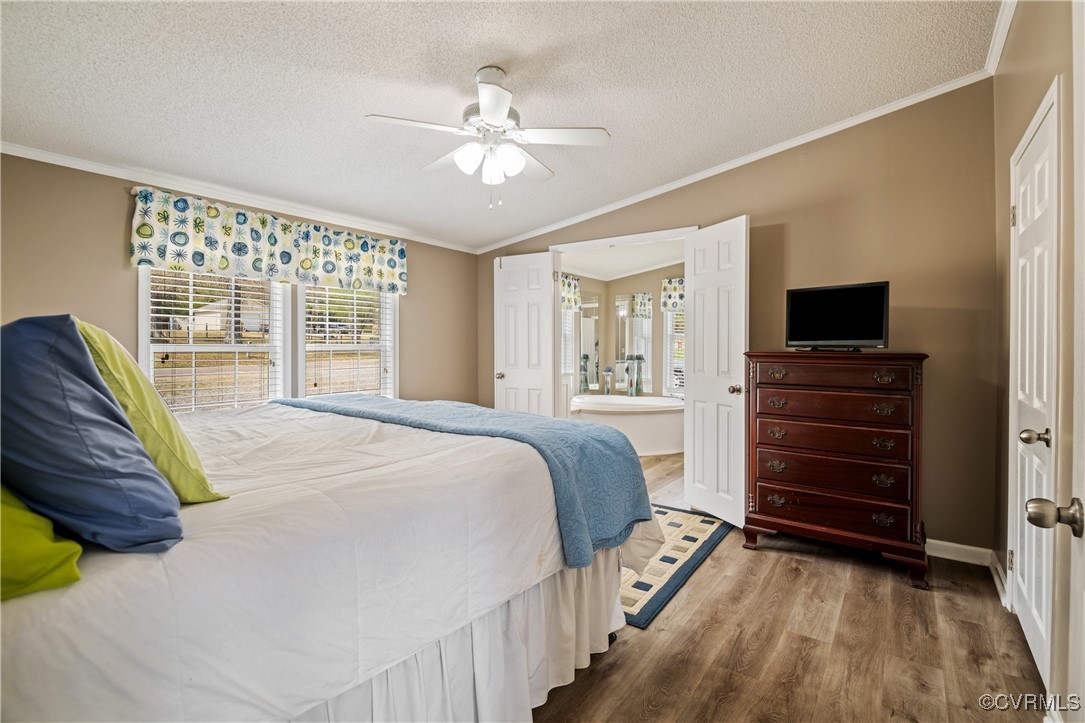 374 James River Overview Spring Grove, VA 23881 - Photo 30 of 49 a spacious bedroom with a bed and a flat screen tv