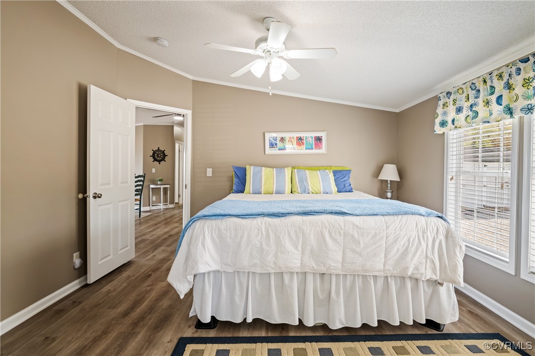 374 James River Overview Spring Grove, VA 23881 - Photo 31 of 49 a bedroom with a large bed and a chandelier