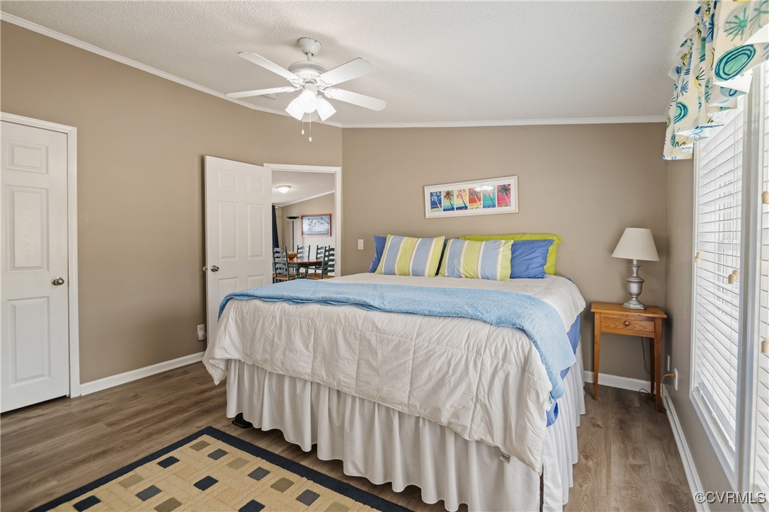 374 James River Overview Spring Grove, VA 23881 - Photo 32 of 49 a bedroom with a bed and a chandelier