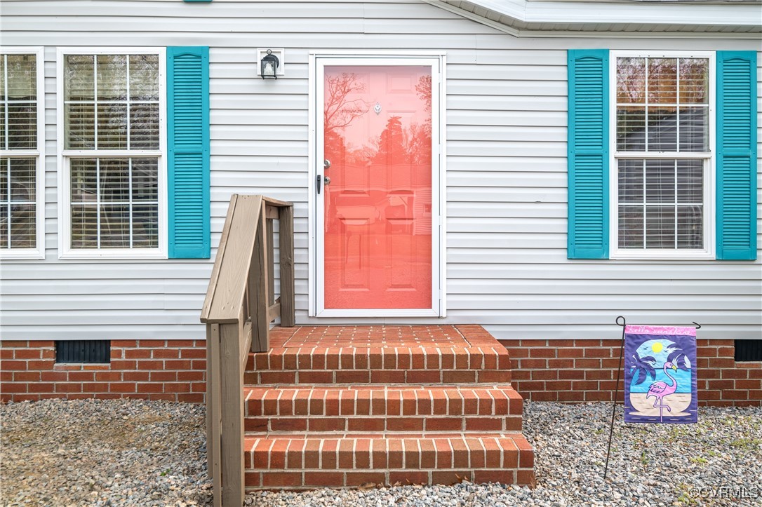 374 James River Overview Spring Grove, VA 23881 - Photo 4 of 49 a front view of a house with large windows
