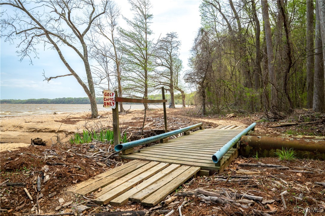 374 James River Overview Spring Grove, VA 23881 - Photo 41 of 49 a view of swimming pool with lawn chairs and wooden fence