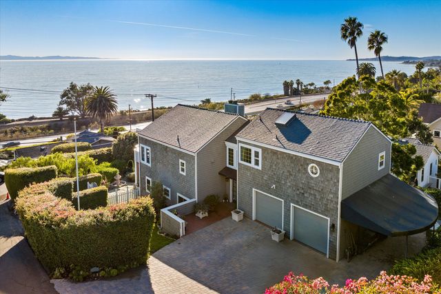 a view of a terrace with a garden and potted plants