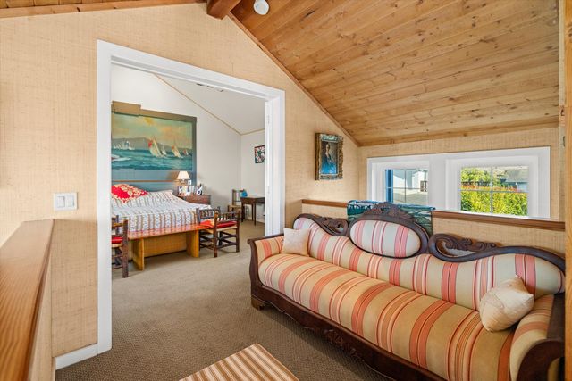 a bedroom with furniture and a window