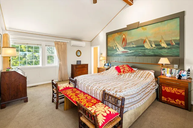 a bed room with a bed and a large window