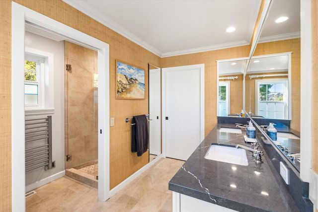 a lobby with furniture and floor to ceiling window