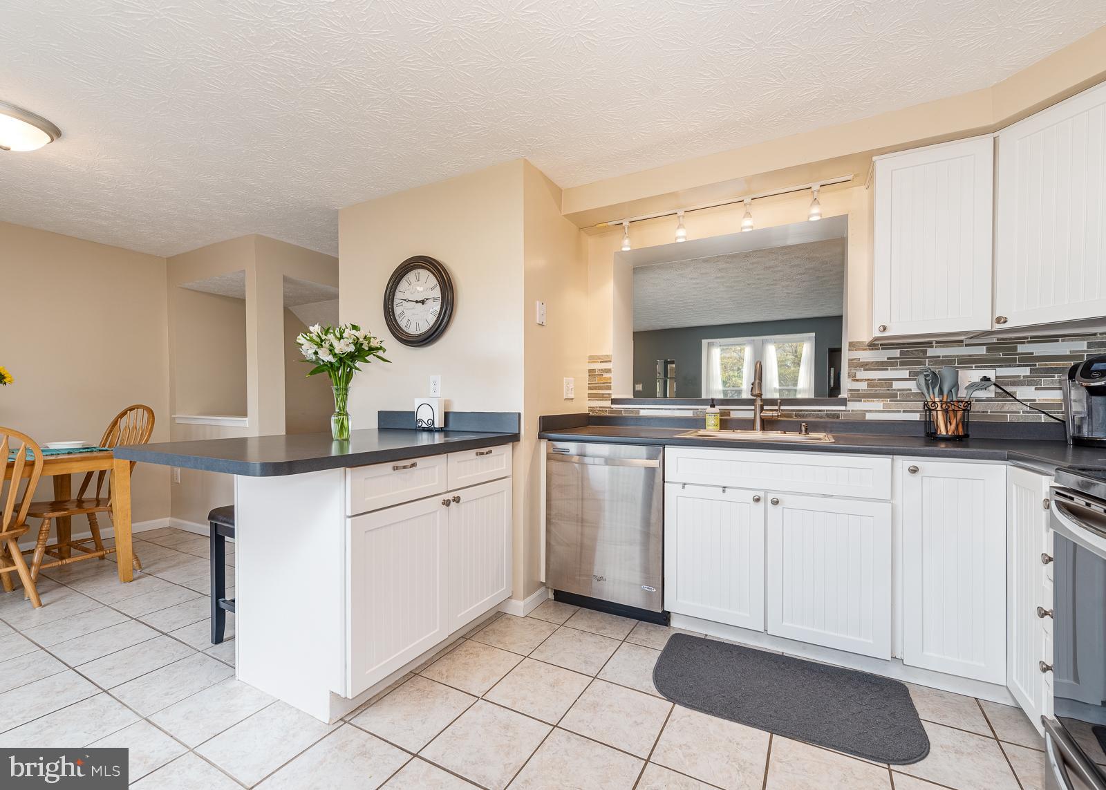 9 Rader Court Baltimore, MD 21234 - Photo 6 of 24 Open kitchen looks into dining and living room
