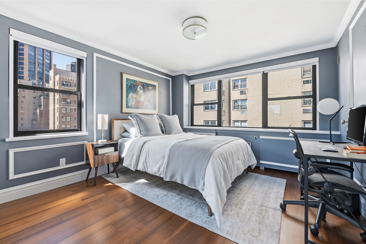 110 East 36th Street, Unit 12B Manhattan, NY 10016 - Photo 8 of 16 a bedroom with a bed and a window