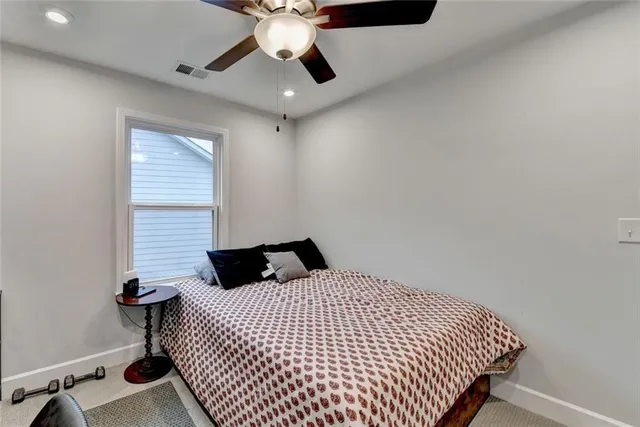 a table tennis room with toys and a bed