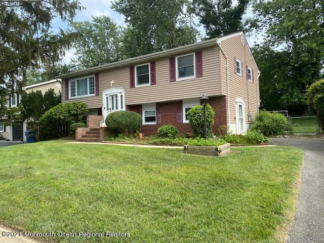 15 Andover Road Jackson, NJ 08527 - Photo 2 of 14 a front view of a house with a yard and trees