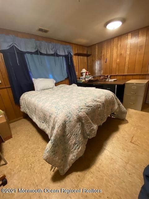 15 Andover Road Jackson, NJ 08527 - Photo 11 of 14 a bed sitting in a bedroom next to a larger closet