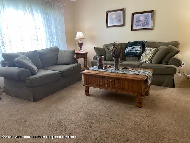 15 Andover Road Jackson, NJ 08527 - Photo 5 of 14 a living room with furniture a bed and a couch