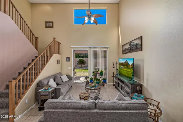 a view of living room with furniture and a flat screen tv
