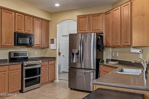 a kitchen with a refrigerator sink and microwave