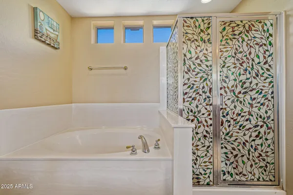 a bathroom with a bathtub and shower