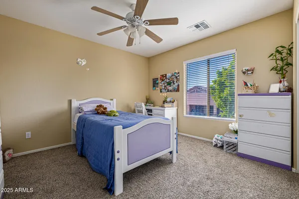 a bed room with a bed and a window